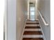 Wooden staircase with white railing and neutral walls leading to the upper level of the home at 2510 Brentwood Ct, Decatur, GA 30032