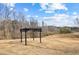 Large grassy yard with a black pergola structure at 260 Sandy Lake Cir, Fayetteville, GA 30214