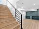Staircase leading to finished basement with luxury vinyl plank flooring and built-in shelving at 260 Sandy Lake Cir, Fayetteville, GA 30214