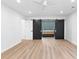 Large empty bedroom with dual barn doors leading to the bathroom with double vanity at 260 Sandy Lake Cir, Fayetteville, GA 30214
