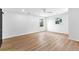 Empty bedroom with two windows providing natural light, ceiling fan, and wood-look floors at 260 Sandy Lake Cir, Fayetteville, GA 30214