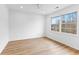 Bright bedroom with wood flooring, ample light from two large windows, and neutral walls at 260 Sandy Lake Cir, Fayetteville, GA 30214