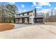 Charming two-story farmhouse featuring a welcoming front porch at 260 Sandy Lake Cir, Fayetteville, GA 30214