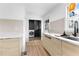Updated kitchen with light wood cabinets, quartz countertops, and stainless steel faucet at 260 Sandy Lake Cir, Fayetteville, GA 30214