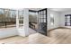 Living room with black-framed doors leading to a deck with black railings at 260 Sandy Lake Cir, Fayetteville, GA 30214