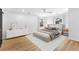 Staged bedroom with light-colored walls, wood floors, natural lighting, and comfortable furniture at 260 Sandy Lake Cir, Fayetteville, GA 30214