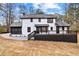 The rear exterior showcases a large deck, a screened porch, and a well-maintained yard at 260 Sandy Lake Cir, Fayetteville, GA 30214