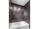 Elegant shower with dark subway tile and contrasting white grout at 260 Sandy Lake Cir, Fayetteville, GA 30214