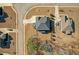 Overhead view of a home showcasing its backyard, driveway, and proximity to surrounding houses and greenery at 4580 Cloister Cir, Hampton, GA 30228