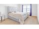Comfortable bedroom featuring a plush bed with light colored sheets, and a window with curtains at 4580 Cloister Cir, Hampton, GA 30228