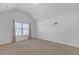 Spacious bedroom featuring neutral walls, plush carpeting and a window at 4580 Cloister Cir, Hampton, GA 30228