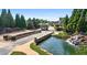 Scenic gated entrance with stone bridge, ponds, and lush landscaping at 4580 Cloister Cir, Hampton, GA 30228