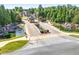 Scenic gated entrance with stone bridge, ponds, and lush landscaping at 4580 Cloister Cir, Hampton, GA 30228