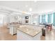 Open-concept living area connected to a kitchen with an island and a breakfast nook at 4580 Cloister Cir, Hampton, GA 30228