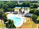 Aerial view of community pool and well-maintained landscaping at 4580 Cloister Cir, Hampton, GA 30228