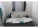 Elegant bathroom featuring a marble vanity, modern sink, and stylish accessories, offering a serene and functional space at 124 Wynn Rd, Mcdonough, GA 30252