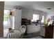 Bright eat-in kitchen featuring white cabinetry, modern appliances, and a cozy breakfast nook with plenty of space at 124 Wynn Rd, Mcdonough, GA 30252
