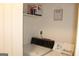 A view of the laundry room features a vintage washer, laundry guide and supplies at 124 Wynn Rd, Mcdonough, GA 30252