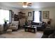 Comfortable living room with plush seating, decorative shelving, and large windows, ideal for relaxation and entertainment at 124 Wynn Rd, Mcdonough, GA 30252
