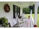 Inviting porch with rocking chairs and plants at 124 Wynn Rd, Mcdonough, GA 30252