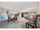 Basement with seating and dining area, mirrored wall, and built-in bar with seating at 4117 Signal Sw Rdg, Lilburn, GA 30047