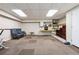 Finished basement features recessed lighting, wall paneling, textured carpet, and vintage decor at 4117 Signal Sw Rdg, Lilburn, GA 30047