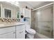 Updated bathroom featuring a walk-in shower, vanity with double sinks, and modern fixtures at 4117 Signal Sw Rdg, Lilburn, GA 30047