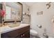 Cozy half bathroom showcasing a stylish vanity, decorative mirror, and a neutral color palette at 4117 Signal Sw Rdg, Lilburn, GA 30047