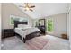 Cozy bedroom with neutral decor, large window views, and soft carpeting throughout at 4117 Signal Sw Rdg, Lilburn, GA 30047