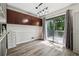 Open dining area with stylish light fixture and sliding glass doors to the outdoor deck at 4117 Signal Sw Rdg, Lilburn, GA 30047