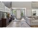 A welcoming home entrance featuring front door, side windows, and wood floors at 4117 Signal Sw Rdg, Lilburn, GA 30047