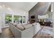 Bright living room featuring a fireplace, access to deck, and hard wood floors at 4117 Signal Sw Rdg, Lilburn, GA 30047