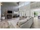 Inviting living room showcasing fireplace, soaring ceilings, and wood floors at 4117 Signal Sw Rdg, Lilburn, GA 30047