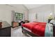 Bright bedroom with vaulted ceiling, large window overlooking deck, and dual closets at 4117 Signal Sw Rdg, Lilburn, GA 30047
