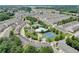 Aerial view of community amenities including a pool, tennis courts, and lush landscaping at 7682 Baron Rd, Fairburn, GA 30213