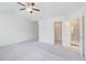 A secondary bedroom offers a private bathroom with a glass enclosed shower and a walk-in closet at 7682 Baron Rd, Fairburn, GA 30213