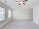 This spacious bedroom features vaulted ceilings and is bathed in plenty of natural light at 7682 Baron Rd, Fairburn, GA 30213