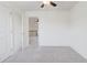 This bedroom offers a peek at the home's hallway and railing at 7682 Baron Rd, Fairburn, GA 30213
