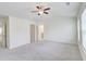 This secondary bedroom features a ceiling fan and includes bathroom and closet access at 7682 Baron Rd, Fairburn, GA 30213