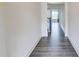 Hallway with dark wood floors at 7682 Baron Rd, Fairburn, GA 30213