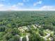 A scenic aerial view of the neighborhood, highlighting mature trees and a mix of roof lines, creating a peaceful residential setting at 1083 Wash Lee Sw Dr, Lilburn, GA 30047