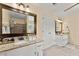 Bright bathroom featuring dual vanities, a shower and tile flooring at 1083 Wash Lee Sw Dr, Lilburn, GA 30047