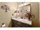 Stylish bathroom with granite countertop and decorative wall art at 1083 Wash Lee Sw Dr, Lilburn, GA 30047