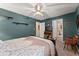 Cozy bedroom featuring a decorative ceiling fan and two closets at 1083 Wash Lee Sw Dr, Lilburn, GA 30047
