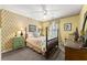 Charming bedroom with patterned wallpaper, traditional furnishings and natural light at 1083 Wash Lee Sw Dr, Lilburn, GA 30047