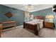 Comfortable bedroom featuring a decorative ceiling fan and wood furniture at 1083 Wash Lee Sw Dr, Lilburn, GA 30047