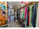 Walk-in closet with customized shelving and ample storage space at 1083 Wash Lee Sw Dr, Lilburn, GA 30047