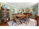 Elegant dining room with classic decor and a wooden table set for a meal at 1083 Wash Lee Sw Dr, Lilburn, GA 30047