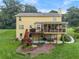 Backyard with screened porch, deck with stairs to yard, well maintained lawn and partially covered patio at 1083 Wash Lee Sw Dr, Lilburn, GA 30047