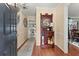 Foyer with hardwood floors, and detailed antique furniture and decor at 1083 Wash Lee Sw Dr, Lilburn, GA 30047